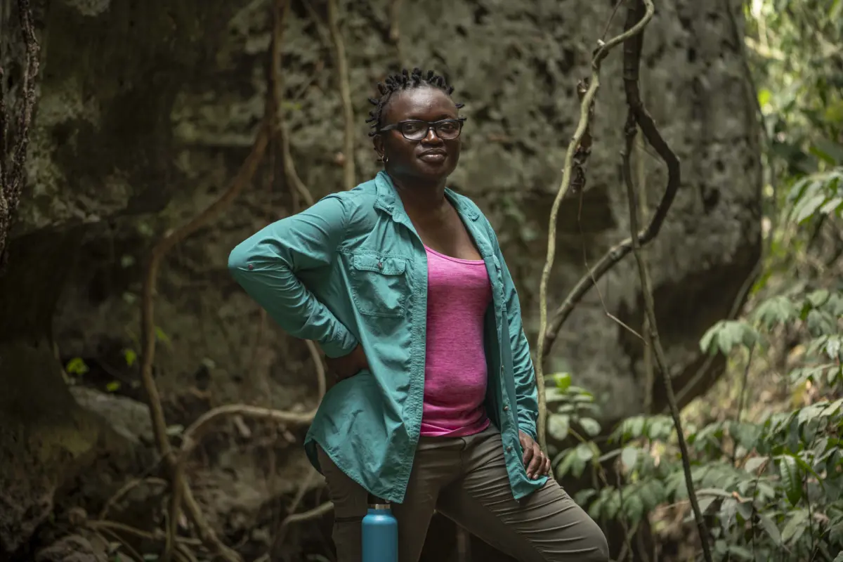 Iroro Tanshi, 39 stands for a portrait near a limestone cave in Etankpini village in Odukpani