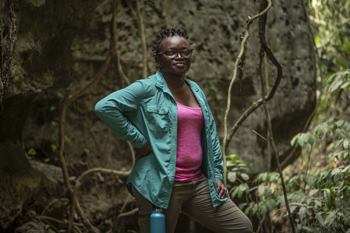 Iroro Tanshi, 39 stands for a portrait near a limestone cave in Etankpini village in Odukpani