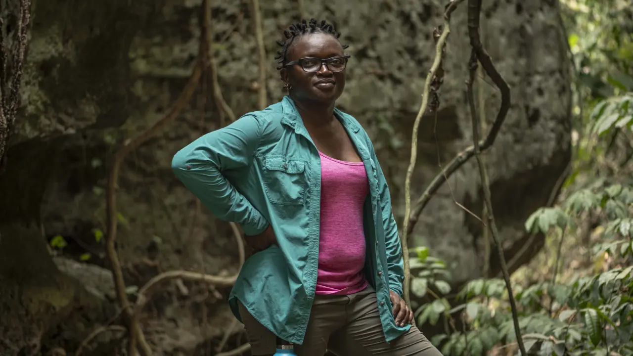 Iroro Tanshi, 39 stands for a portrait near a limestone cave in Etankpini village in Odukpani