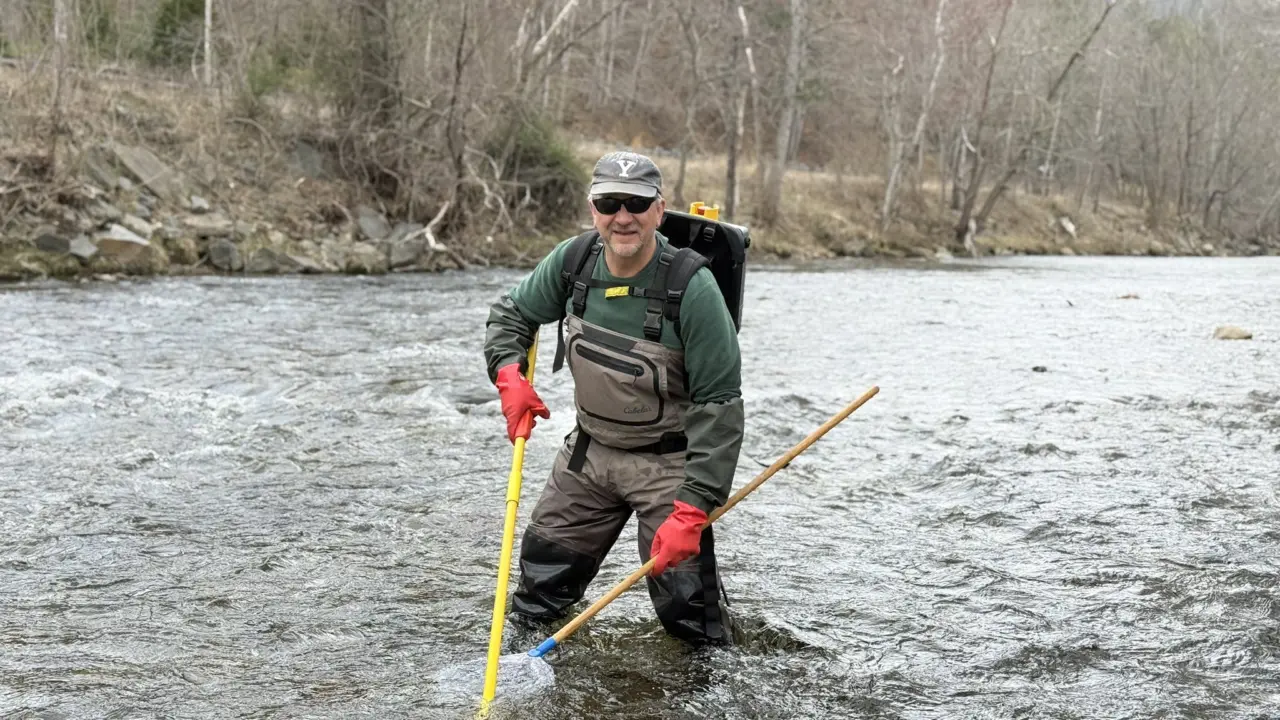 A man standing in a review using nets to fish.