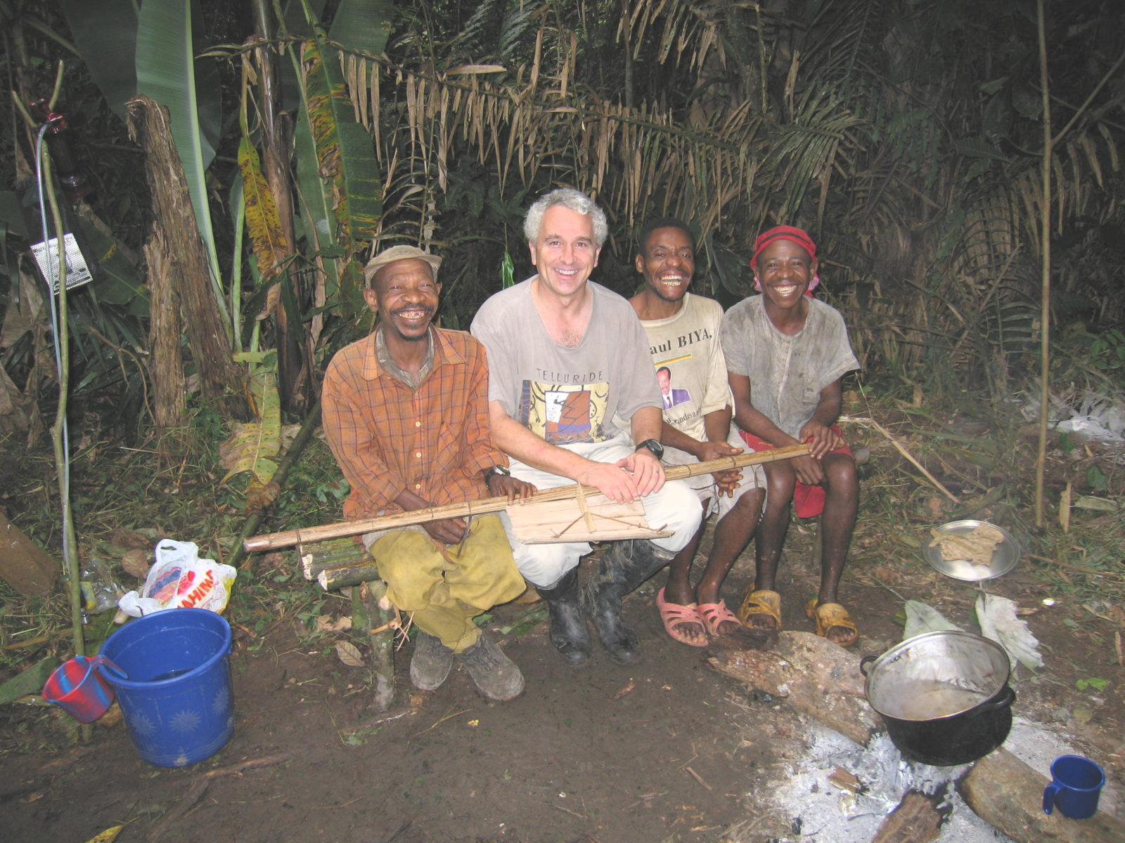 Tom Smith poses with Baka guides, who have helped him get around in Central Africa.