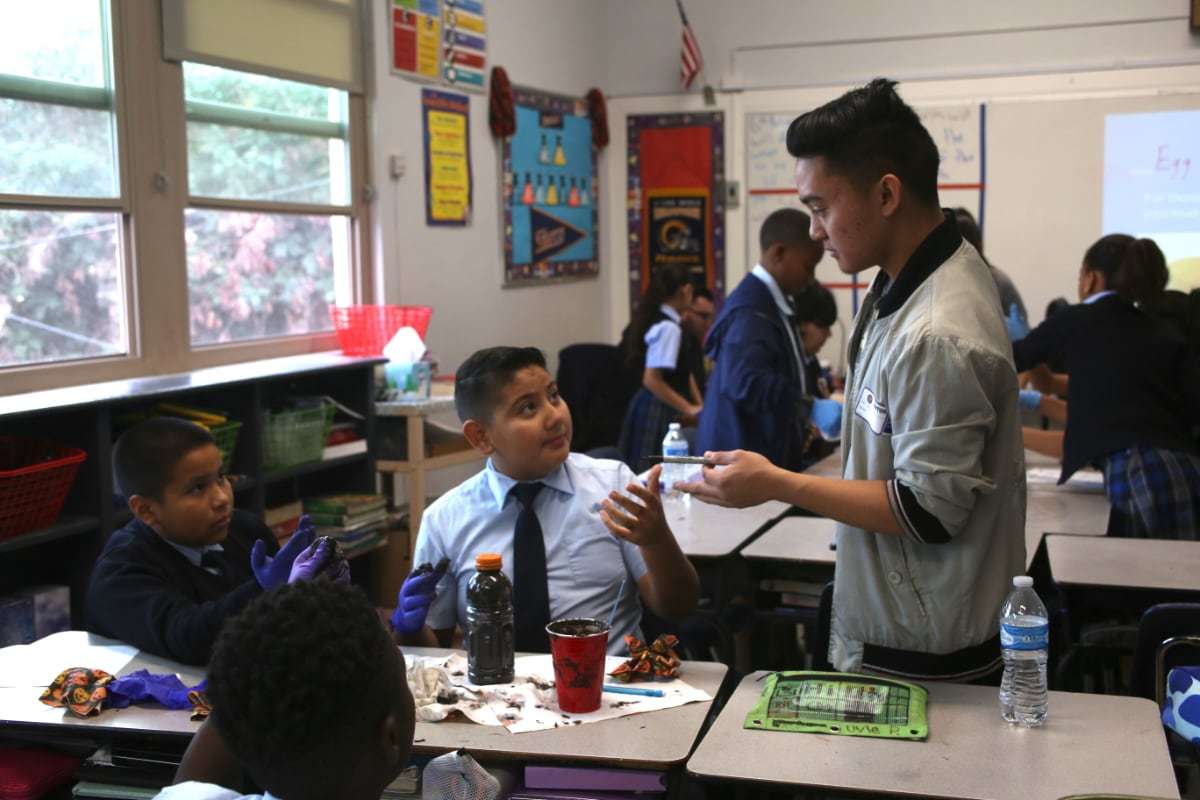 Mentor teaching young student